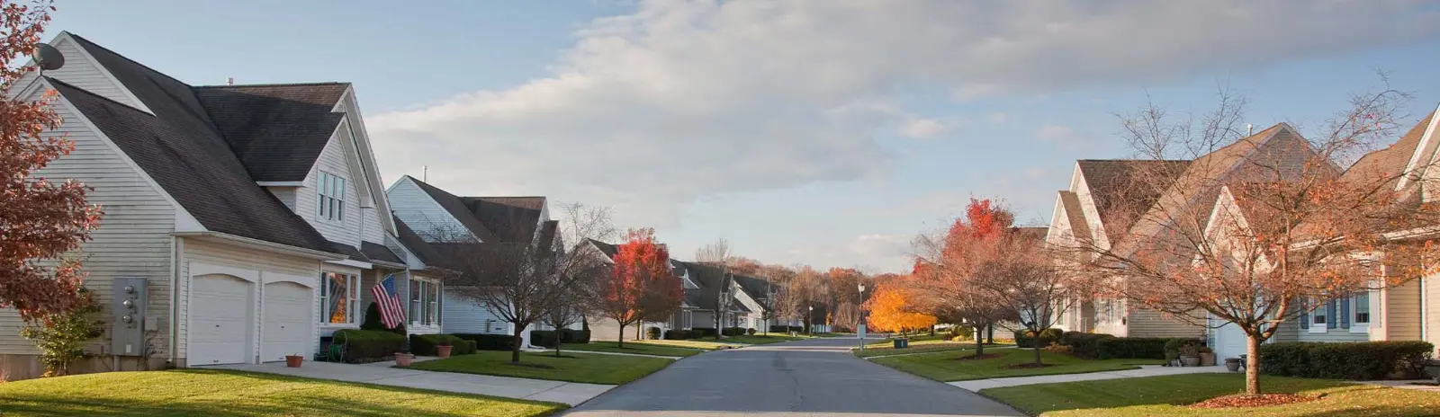 Tree-lined residential street with autumn colors
